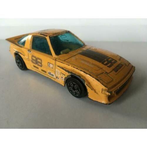 Bburago Mazda RX-7, geel met decals, 1/43